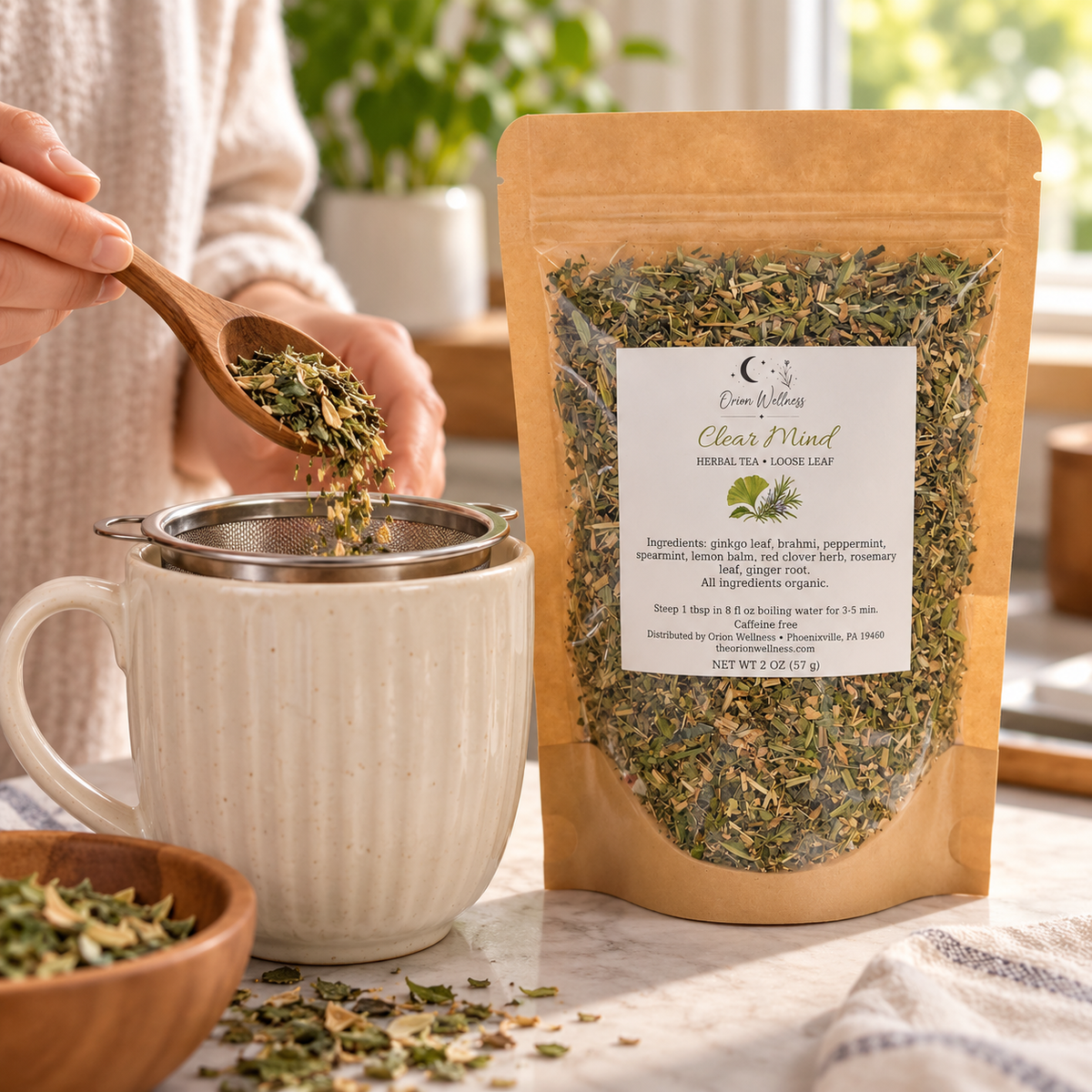 Orion Wellness Clear Mind 2 oz loose leaf tea being prepared with an infuser