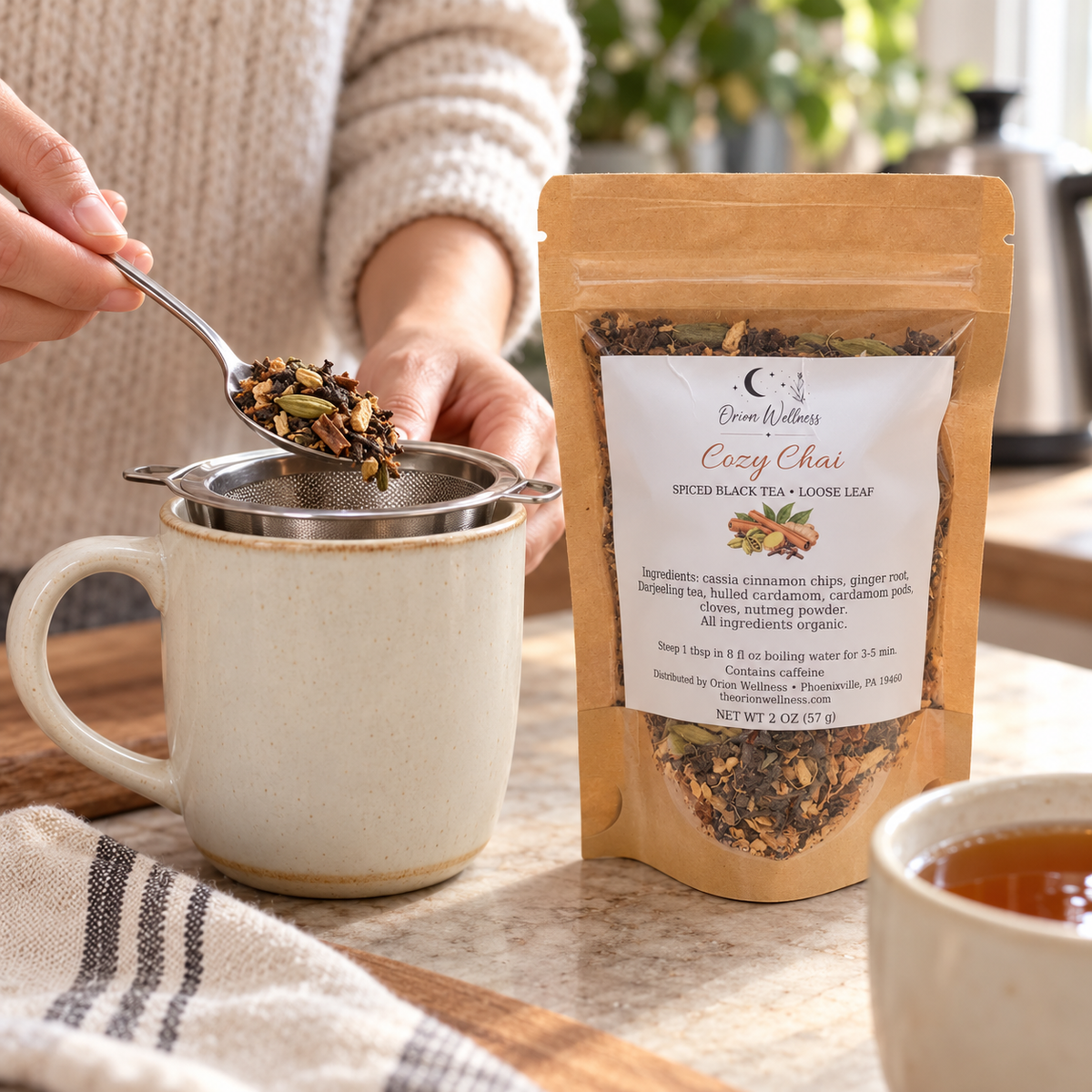 Orion Wellness cozy chai loose leaf tea, being prepared with a tea infuser