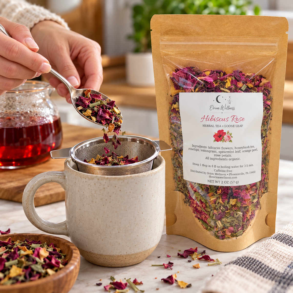 Orion Wellness Hibiscus Rose 2 oz loose leaf tea being prepared with an infuser