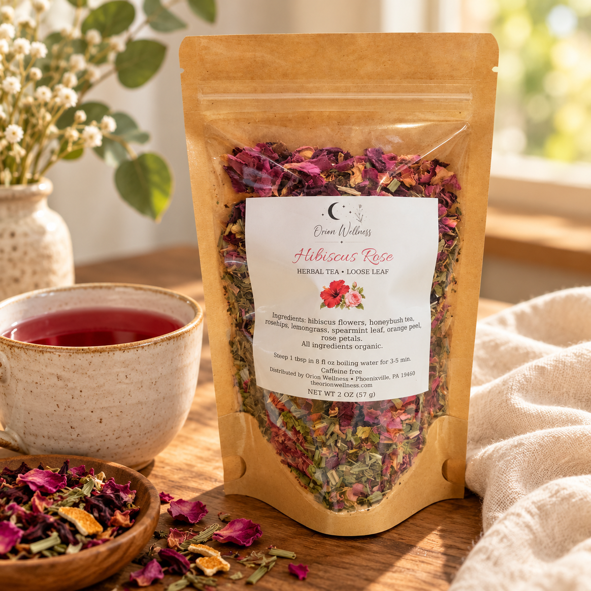 Orion Wellness Hibiscus Rose 2 oz loose leaf tea in a lifestyle setting