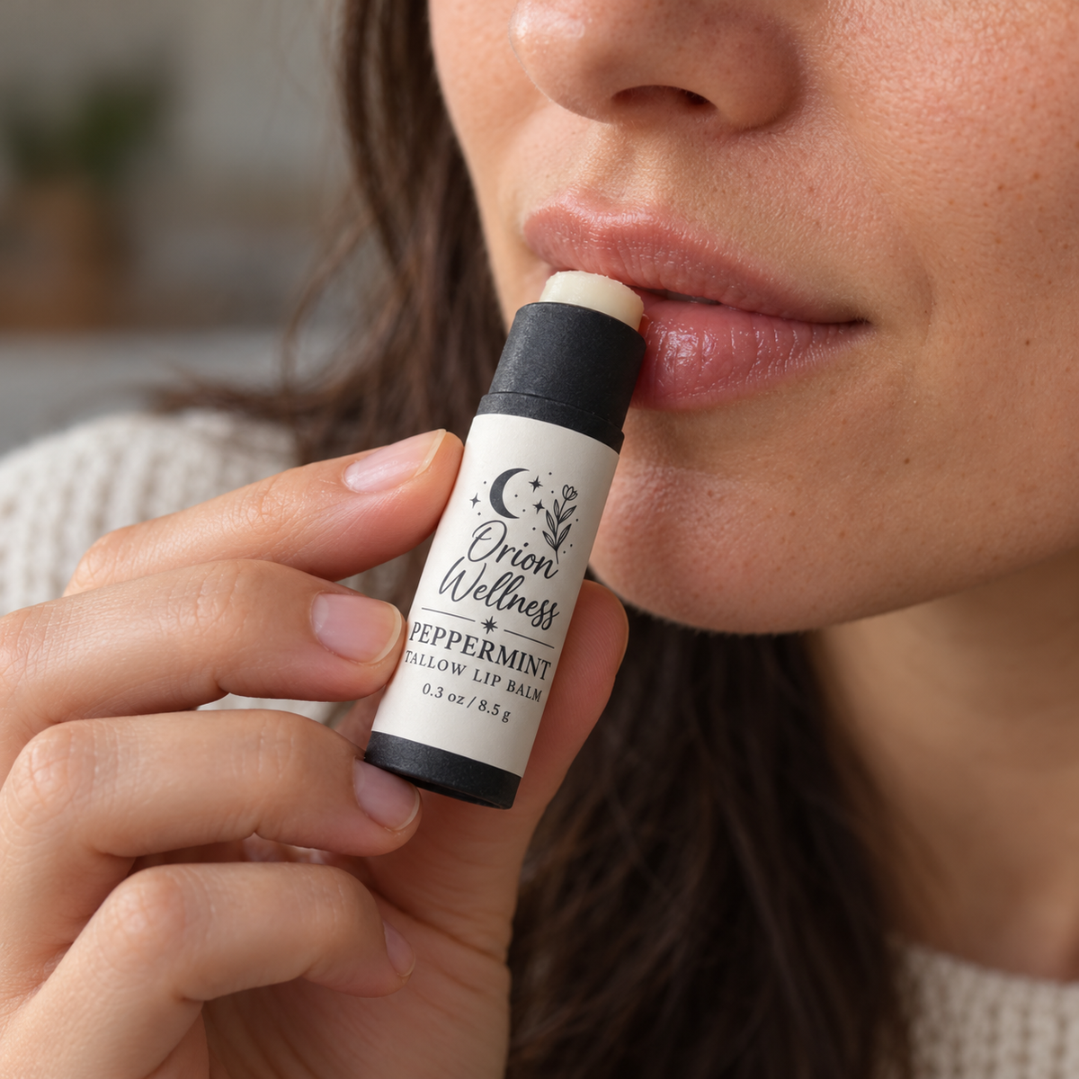 Applying Orion Wellness Peppermint Tallow Lip Balm
