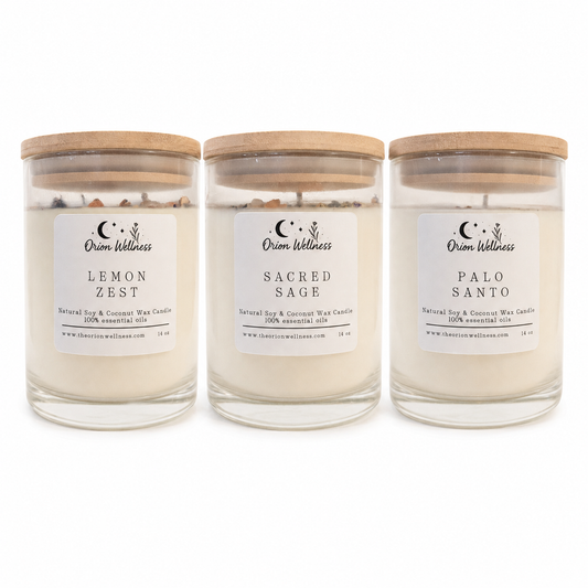 Orion Wellness 14 oz Lemon Zest, Sacred Sage and Palo Santo candles with wood lids on a white background.