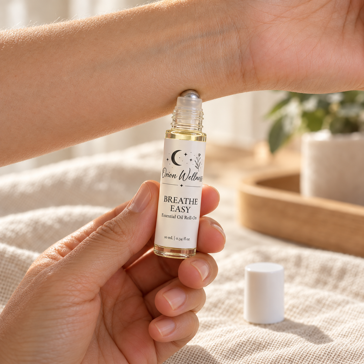Orion Wellness Breathe Easy 10 mL roll-on applied to the inner wrist