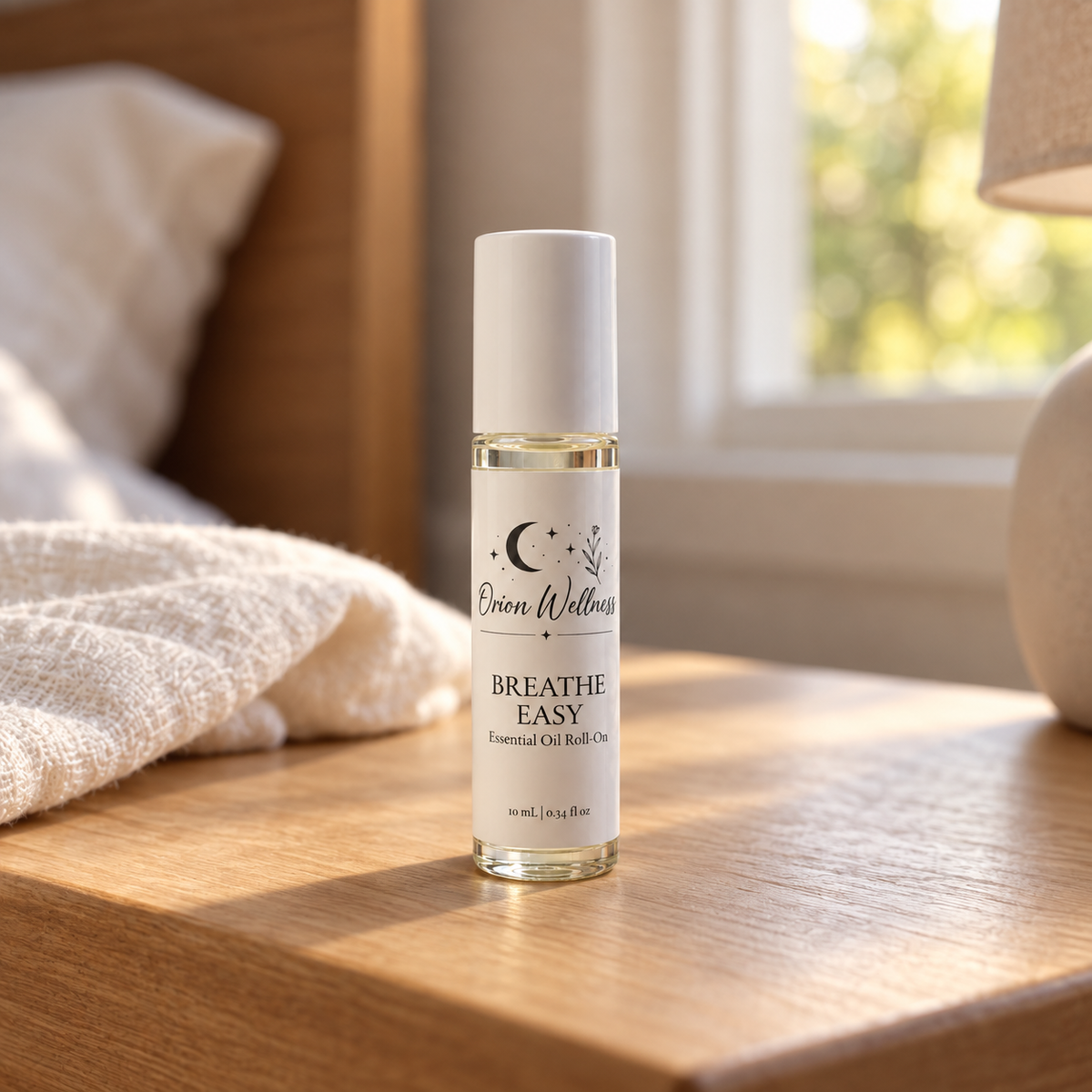 Orion Wellness Breathe Easy 10 mL roll-on in a warm natural home setting