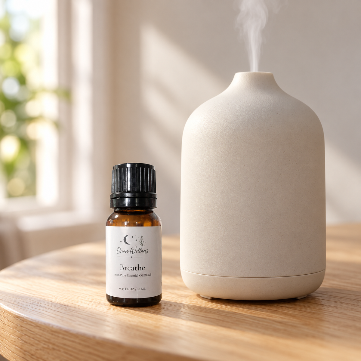 Orion Wellness Breathe 10 mL diffuser blend beside a running diffuser