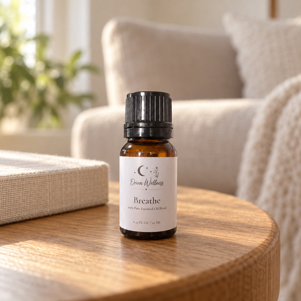 Orion Wellness Breathe 10 mL diffuser blend on a living room side table