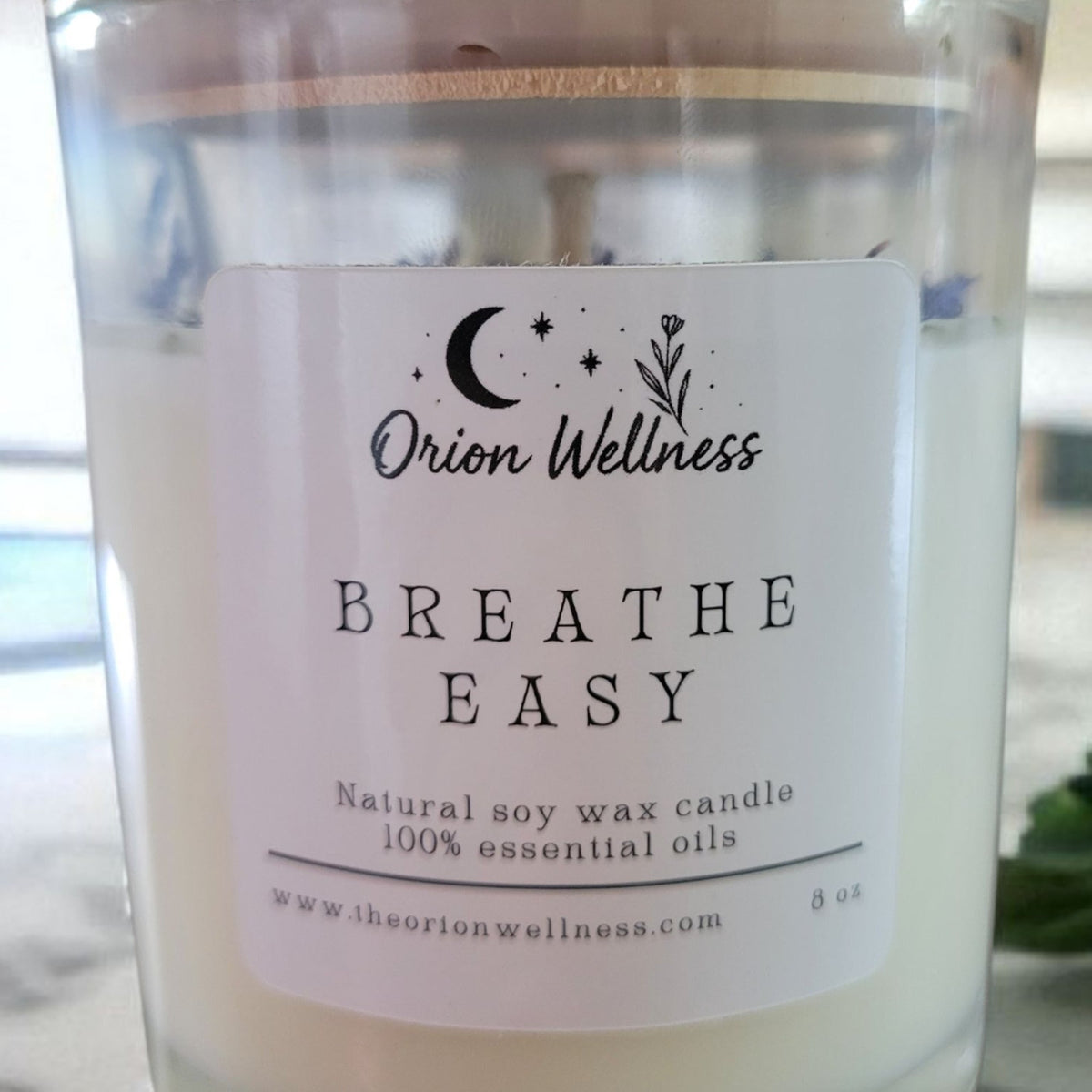 Close-up of Breathe Easy Candle label by Orion Wellness