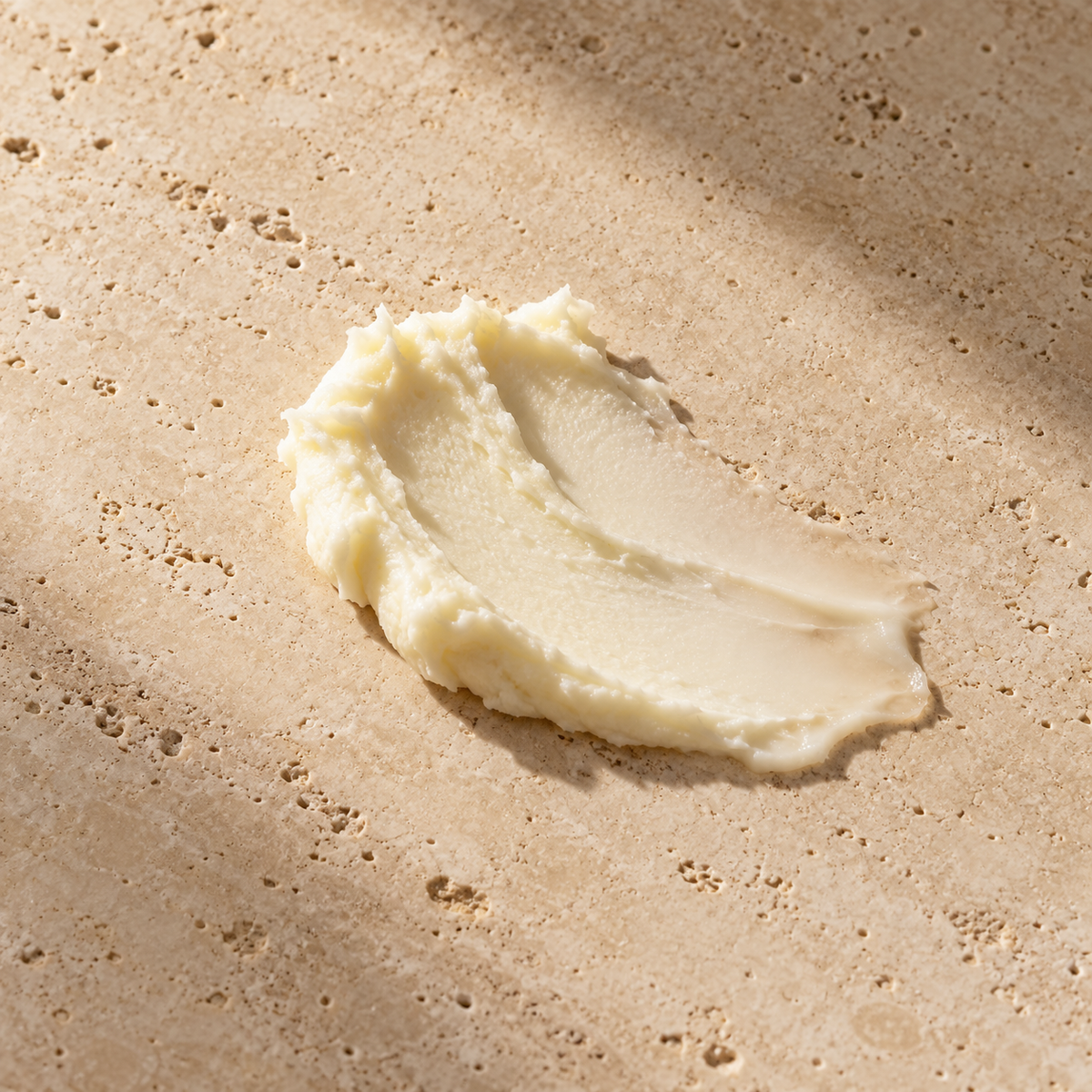 Orion Wellness butter styled texture illustration on warm travertine