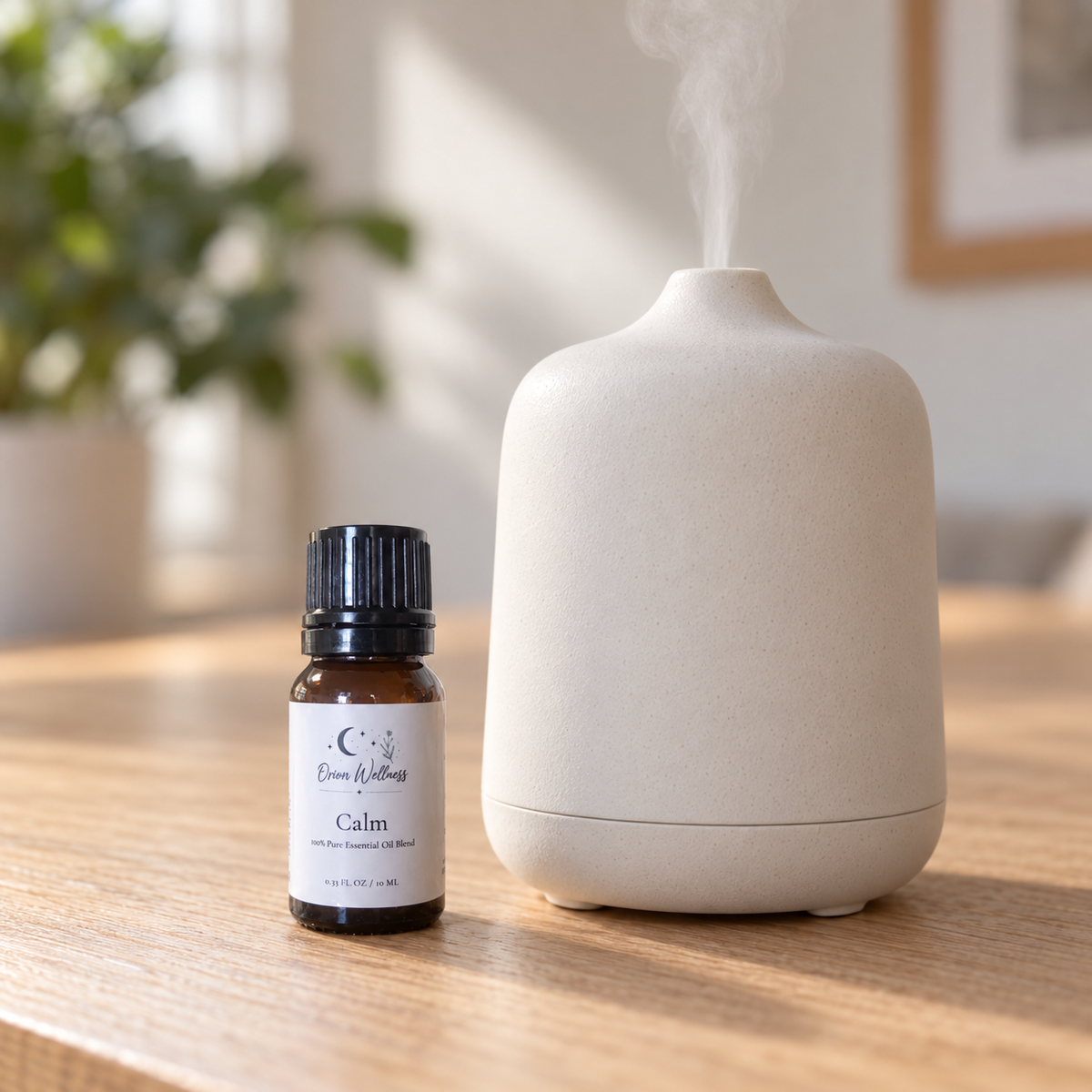 Orion Wellness Calm 10 mL diffuser blend beside a running diffuser