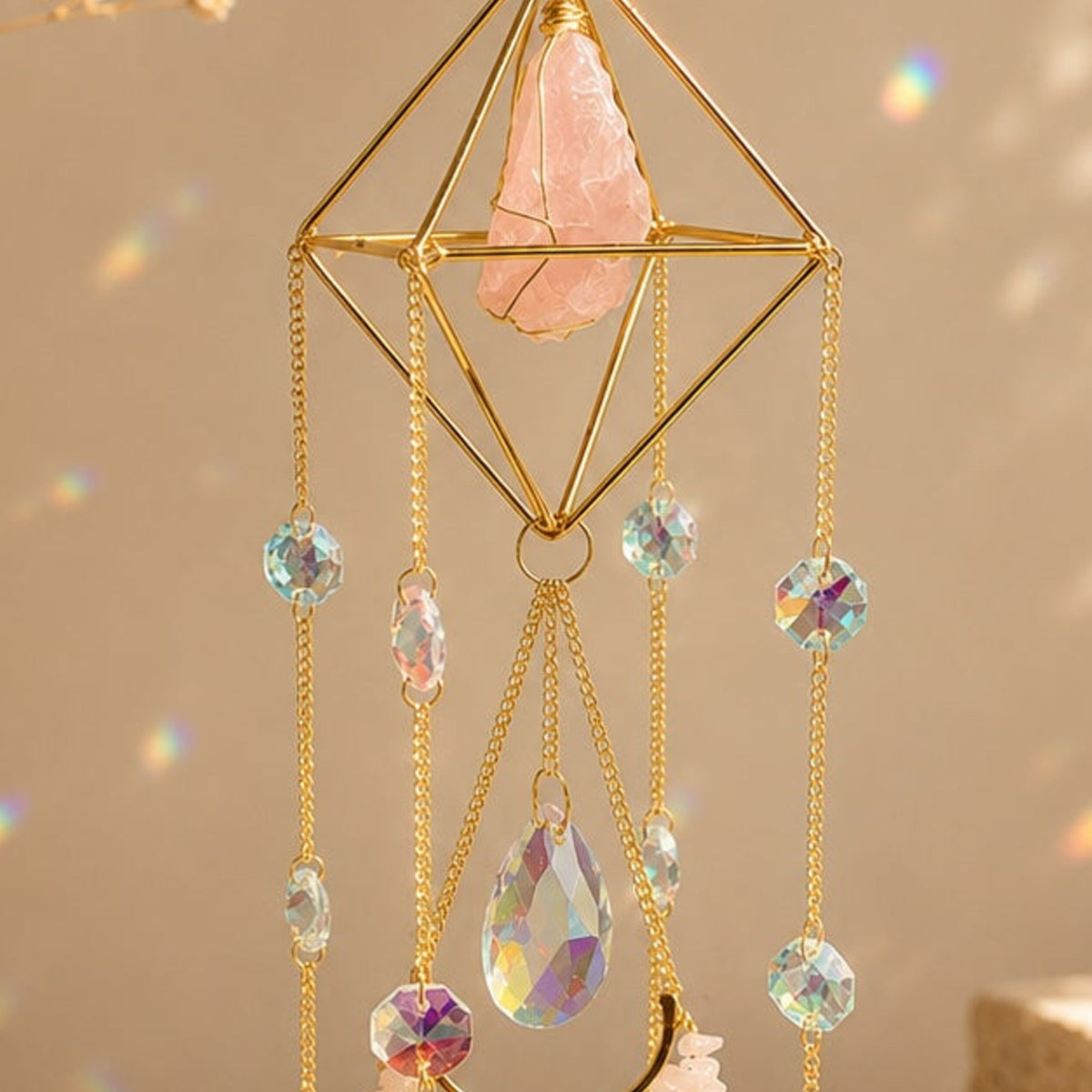 Close-up detail of Celestial Rose Quartz Sun Catcher crystal and hanging prisms