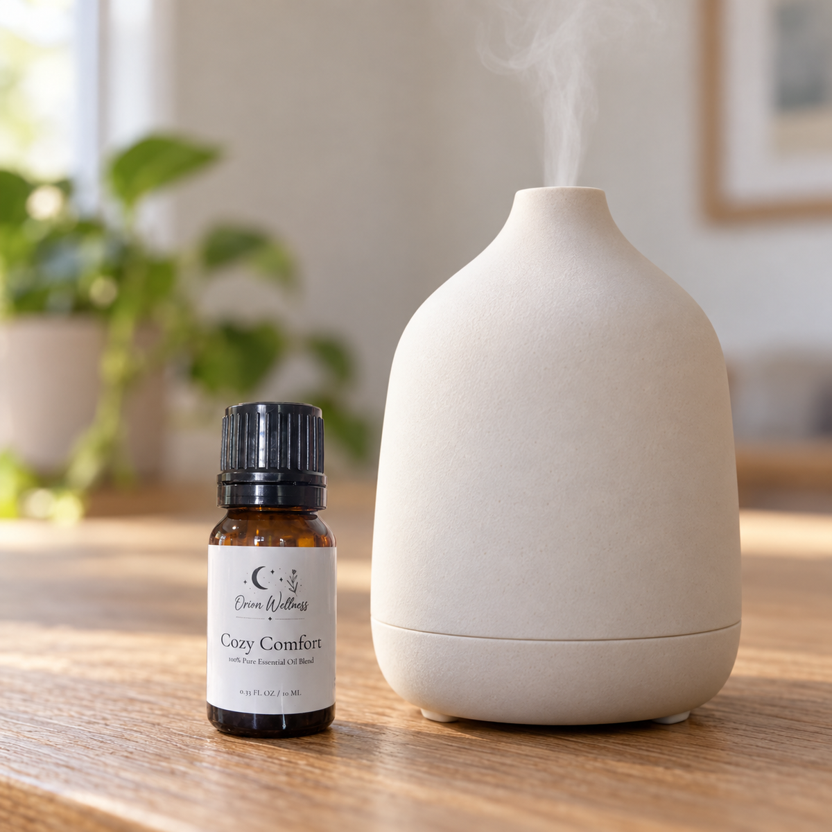 Orion Wellness Cozy Comfort 10 mL diffuser blend beside a running diffuser