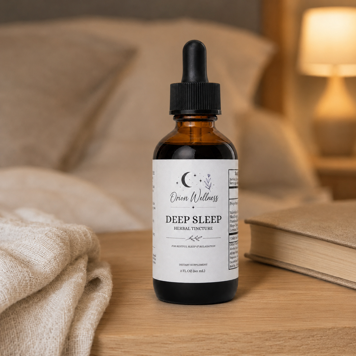 Orion Wellness Deep Sleep tincture on an oak bedside table beside a clothbound book, with linen bedding and warm lamplight.