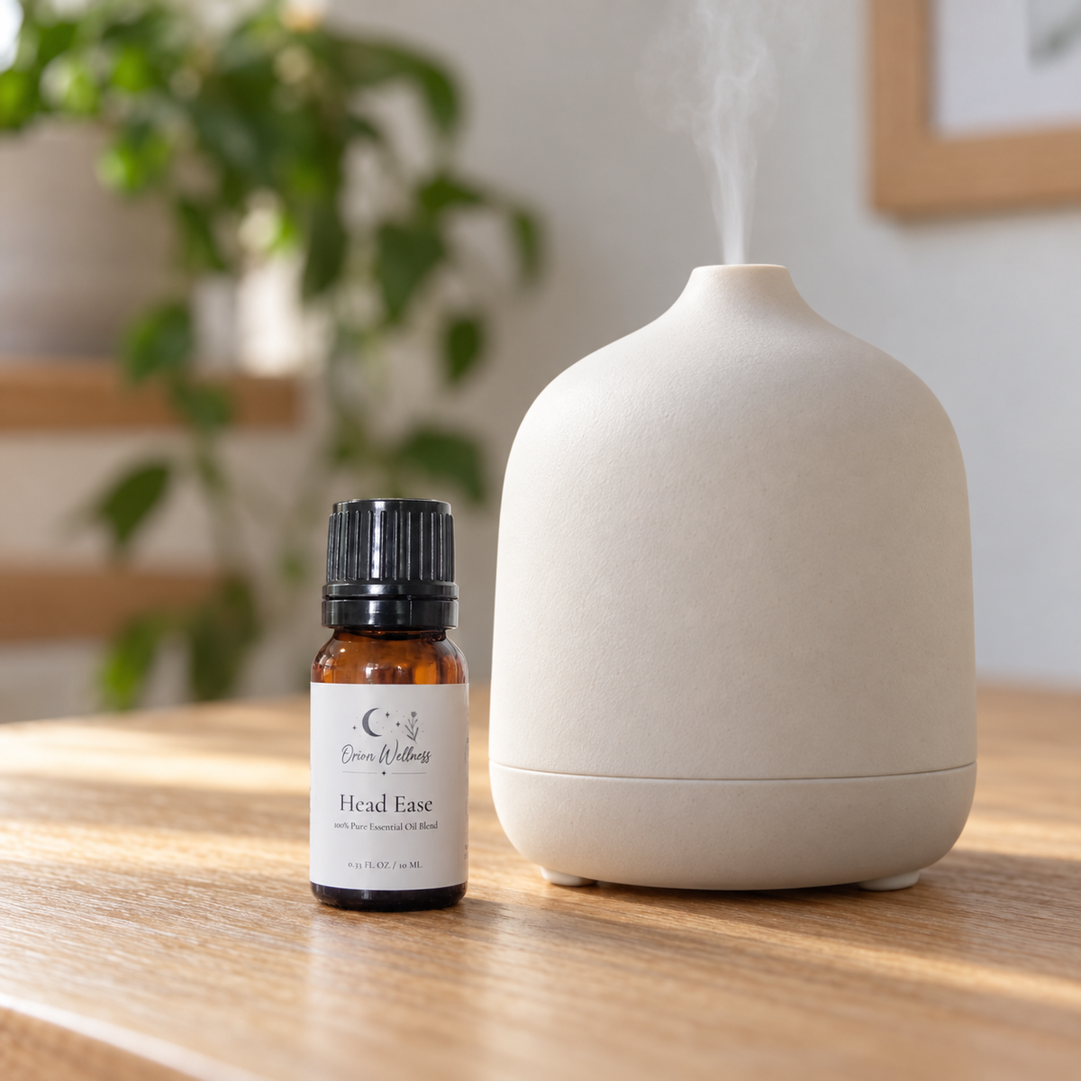 Orion Wellness Head Ease 10 mL diffuser blend beside a running diffuser