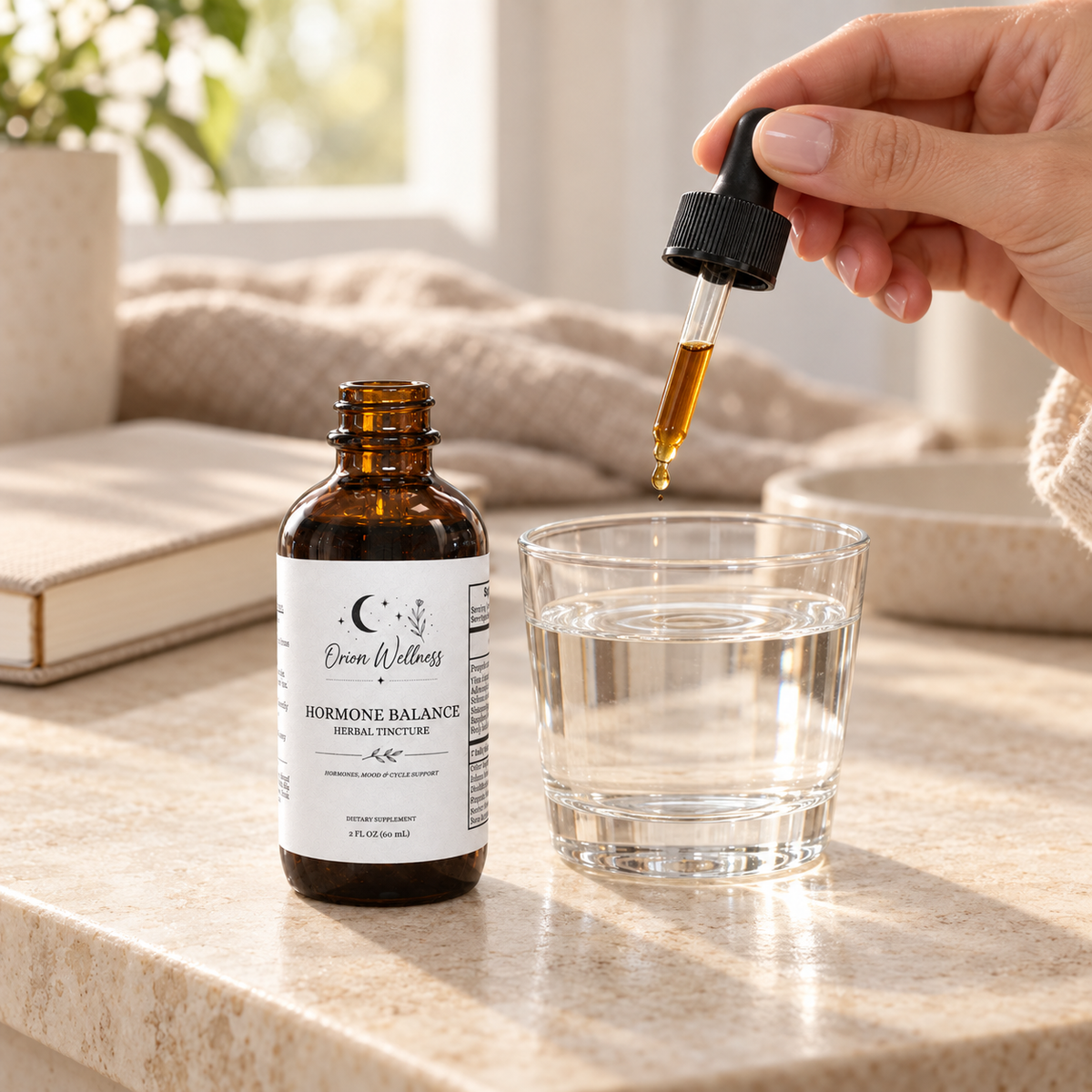 Orion Wellness Hormone Balance Herbal Tincture, 2 oz amber bottle with dropper being added to a glass of water.