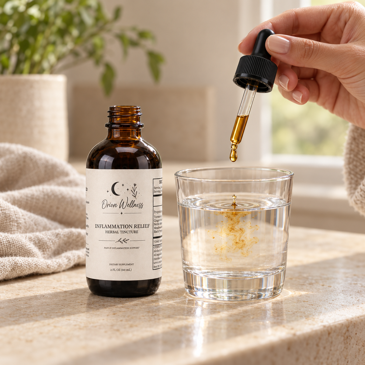 Orion Wellness Inflammation Relief Herbal Tincture, 2 oz amber bottle with dropper being added to a glass of water.