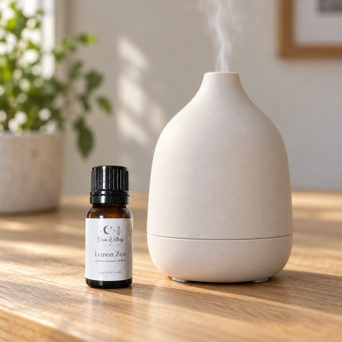 Orion Wellness Lemon Zest 10 mL diffuser blend beside a running diffuser