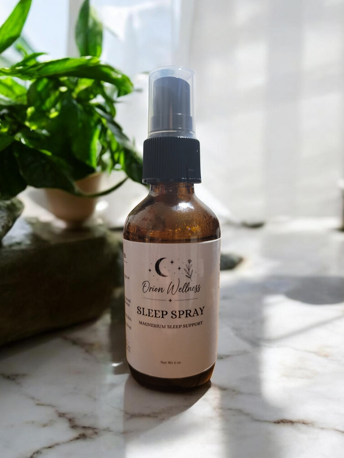 Orion Wellness Magnesium Sleep Spray styled in soft natural window light