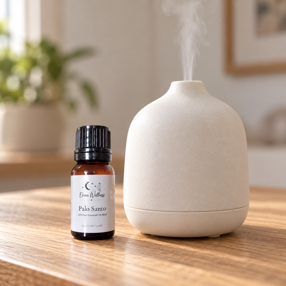 Orion Wellness Palo Santo 10 mL diffuser blend beside a running diffuser