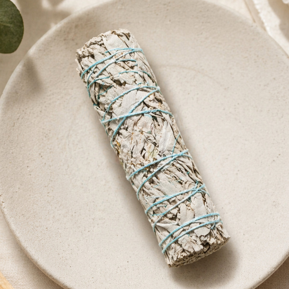 Close-up of Sacred White Sage Bundle label by Orion Wellness