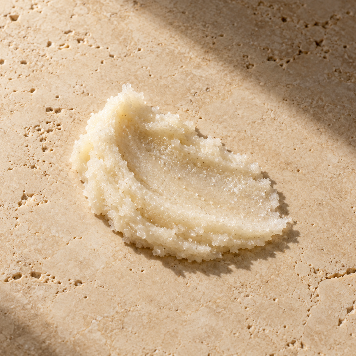 Orion Wellness sugar polish styled texture illustration on warm travertine