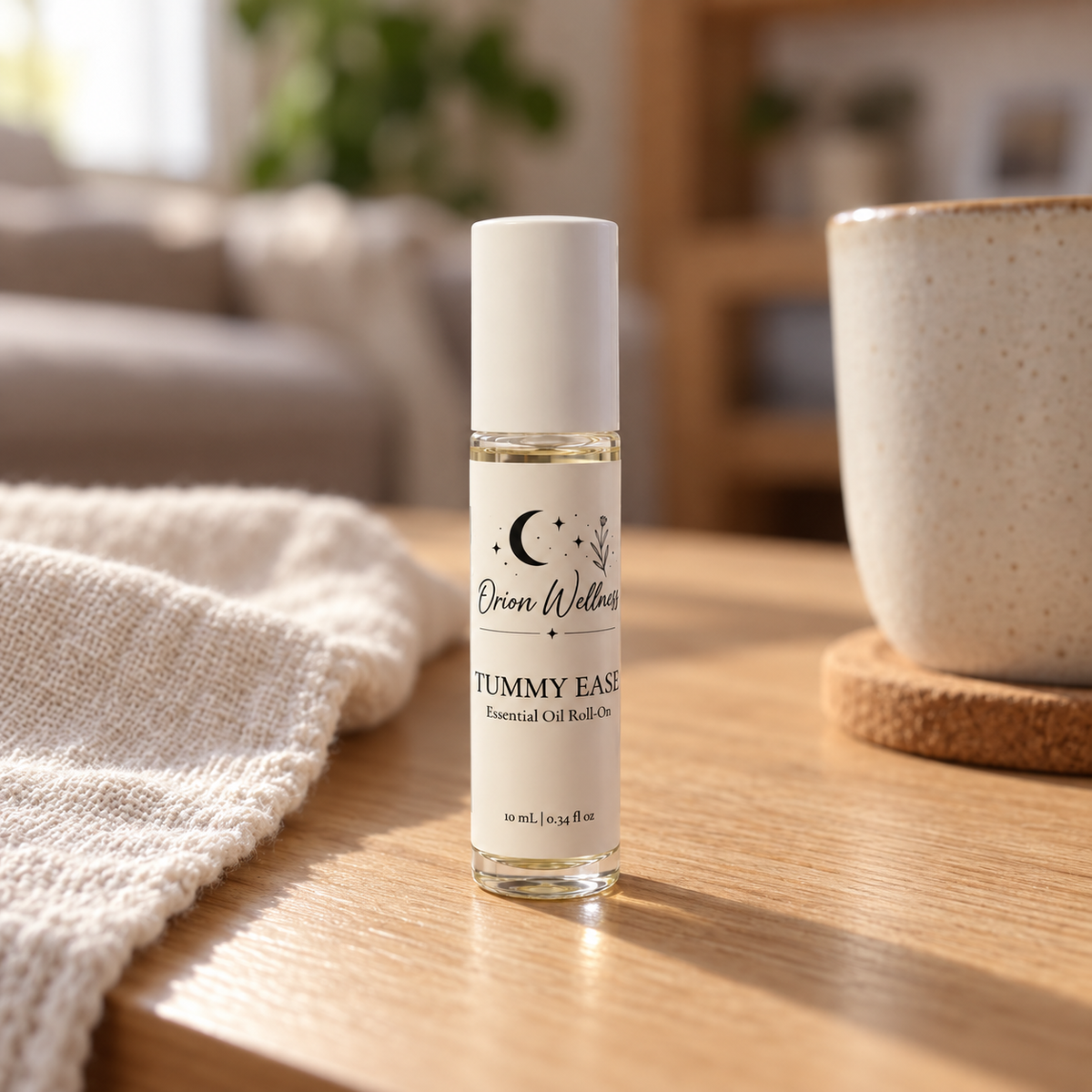 Orion Wellness Tummy Ease 10 mL roll-on in a warm natural home setting