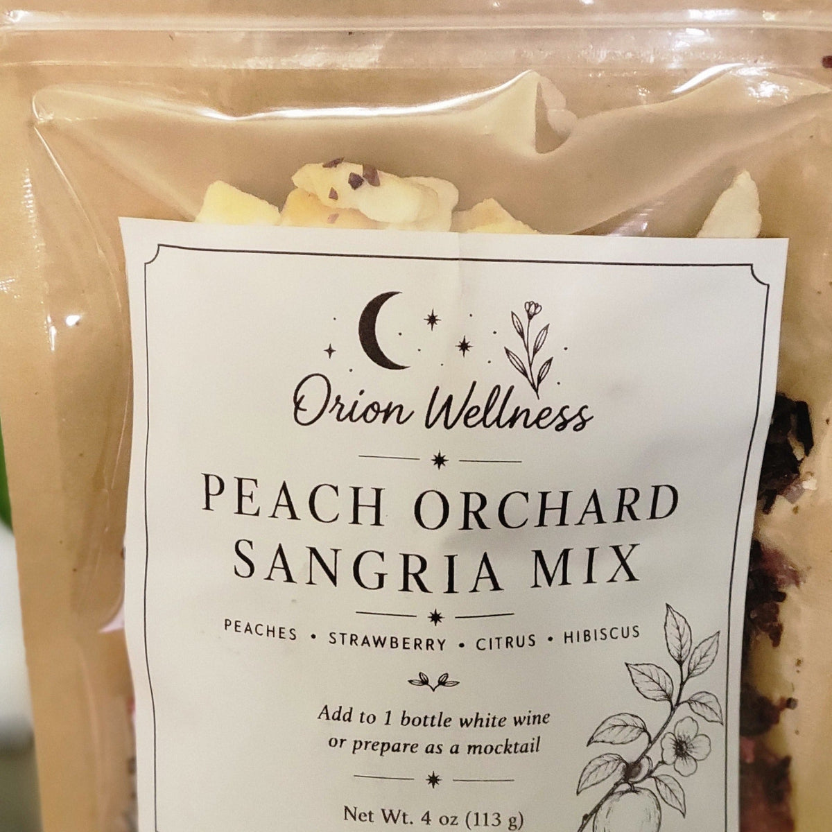 Close-up of Peach Orchard Sangria label by Orion Wellness