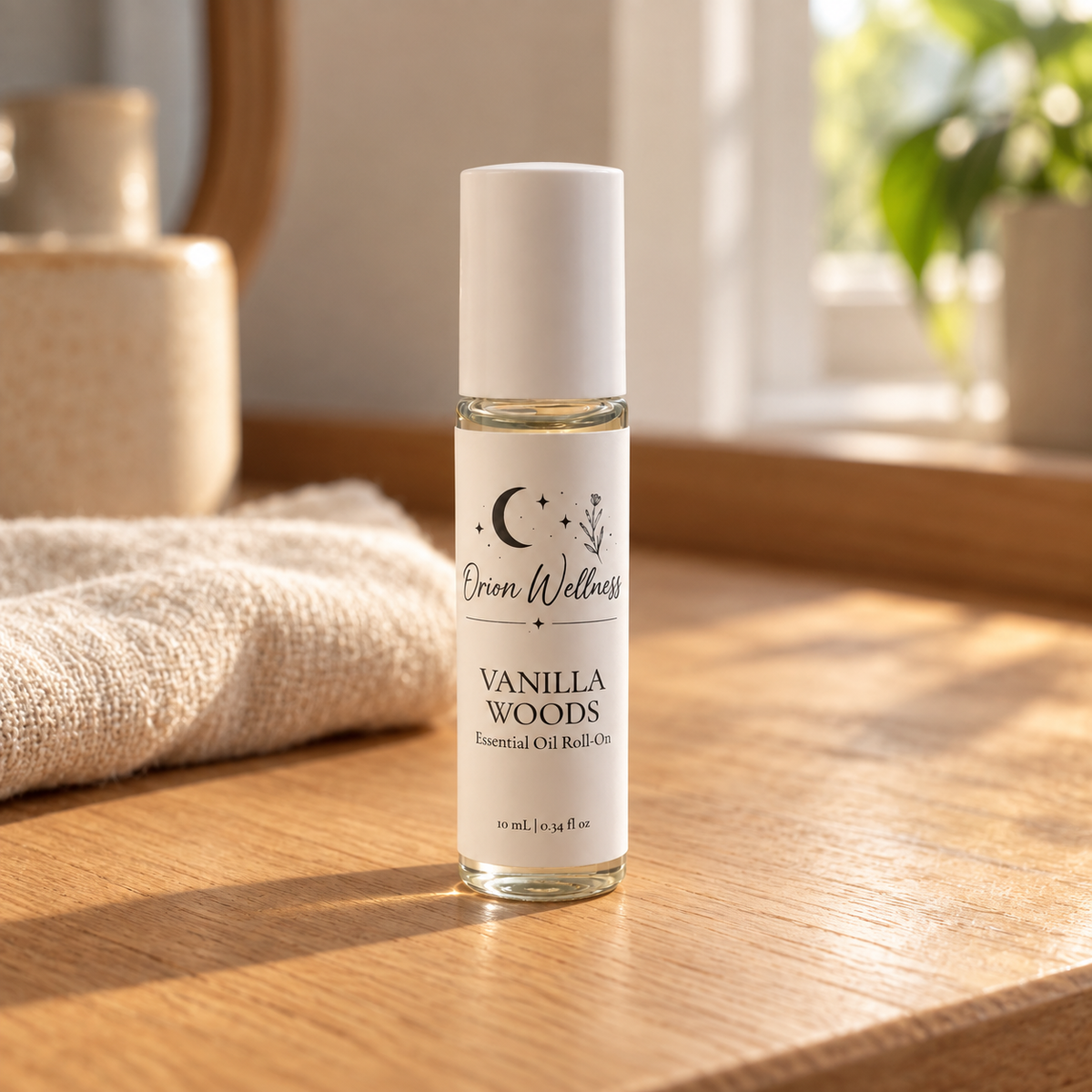 Orion Wellness Vanilla Woods 10 mL roll-on in a warm natural home setting