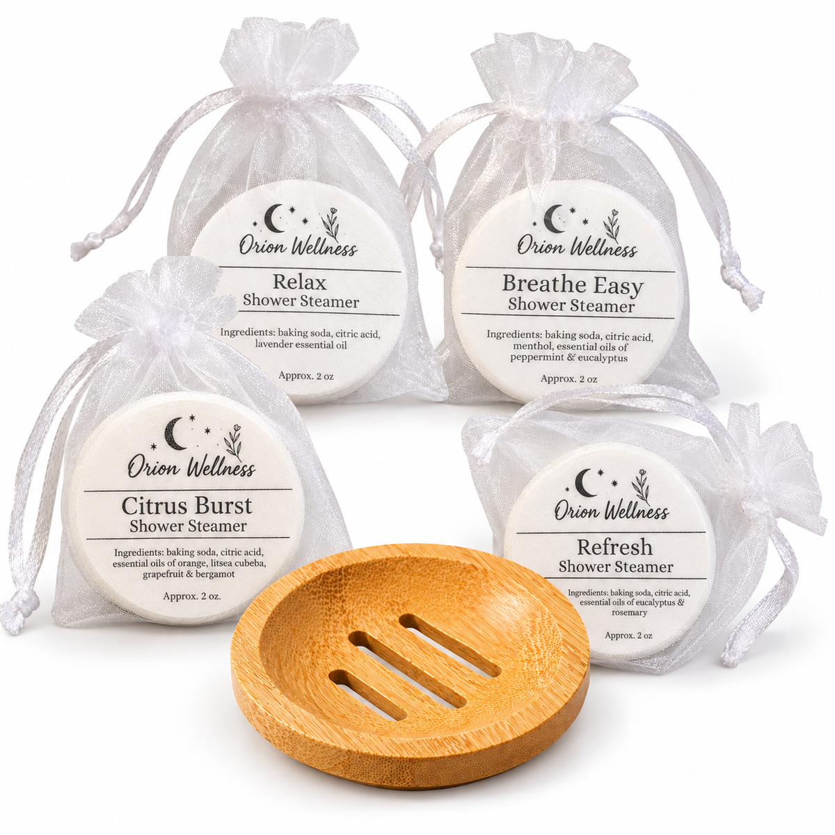 Current four shower steamers and round bamboo tray on white background
