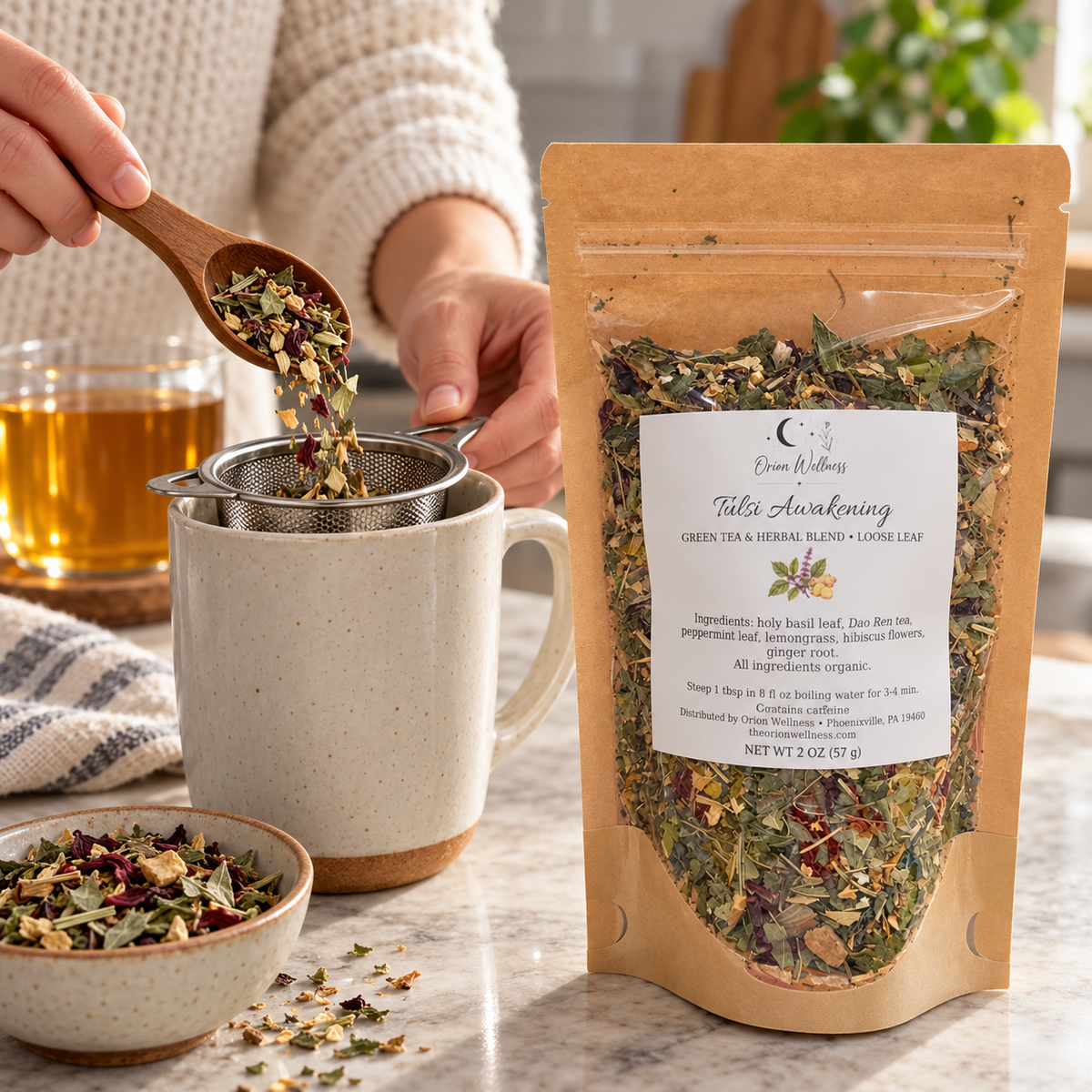 Orion Wellness Tulsi Awakening 2 oz loose leaf tea being prepared with an infuser