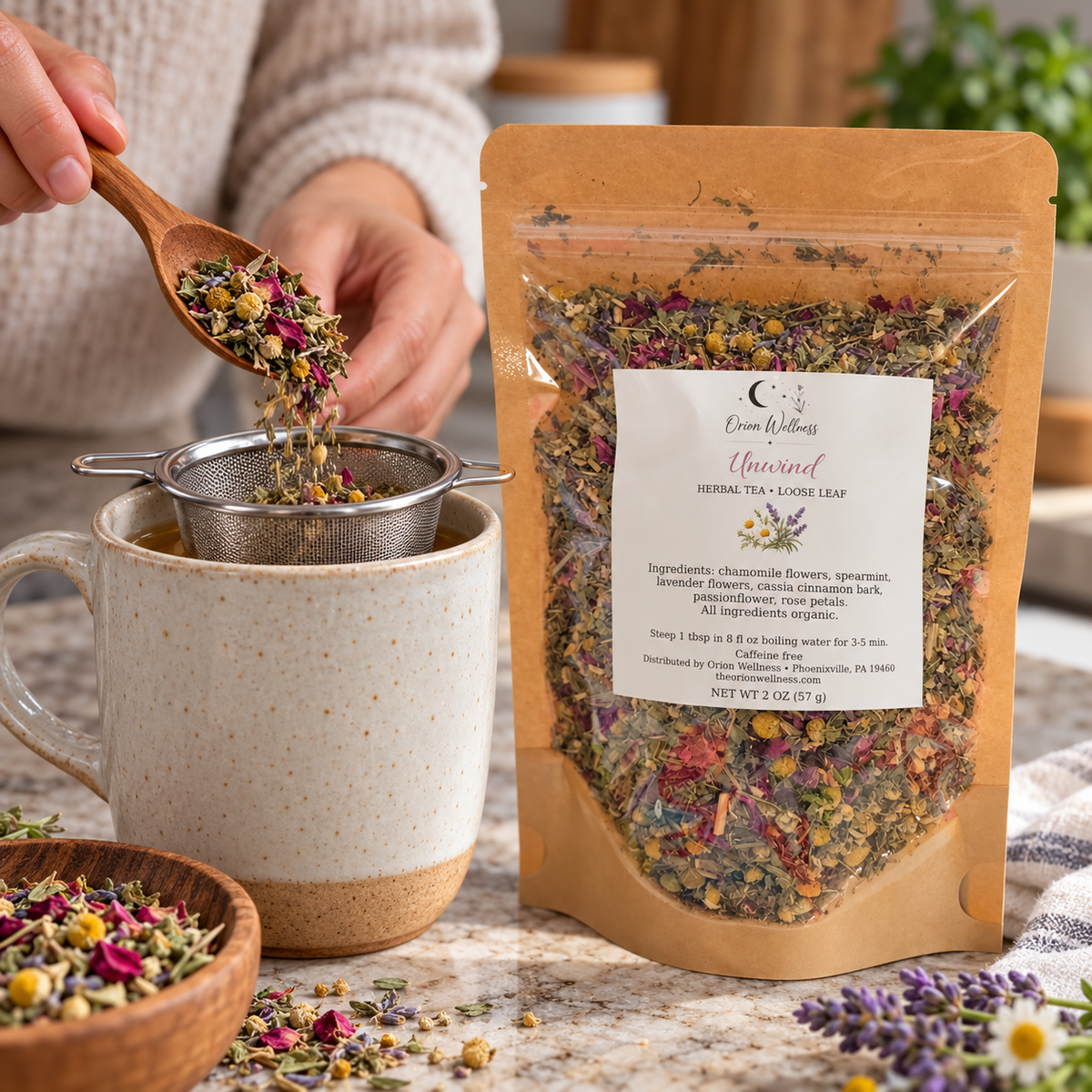 Orion Wellness Unwind 2 oz loose leaf tea being prepared with an infuser