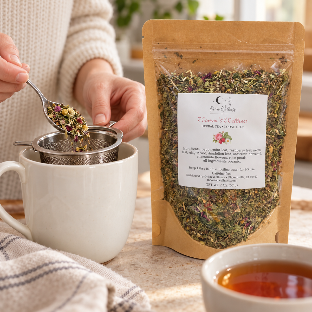 Orion Wellness womens wellness loose leaf tea, being prepared with a tea infuser